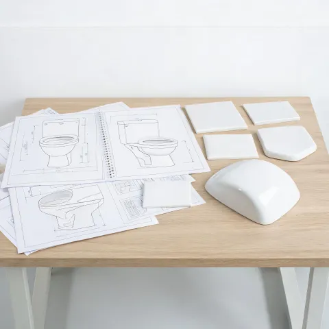 Specification desk reviewing toilet package drawings